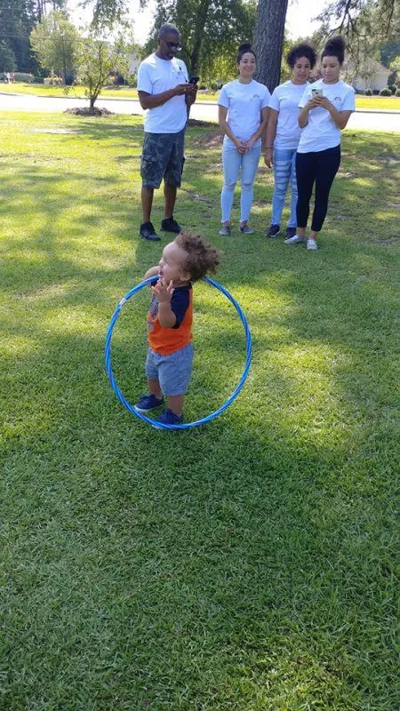 Members and children spending time together outdoors