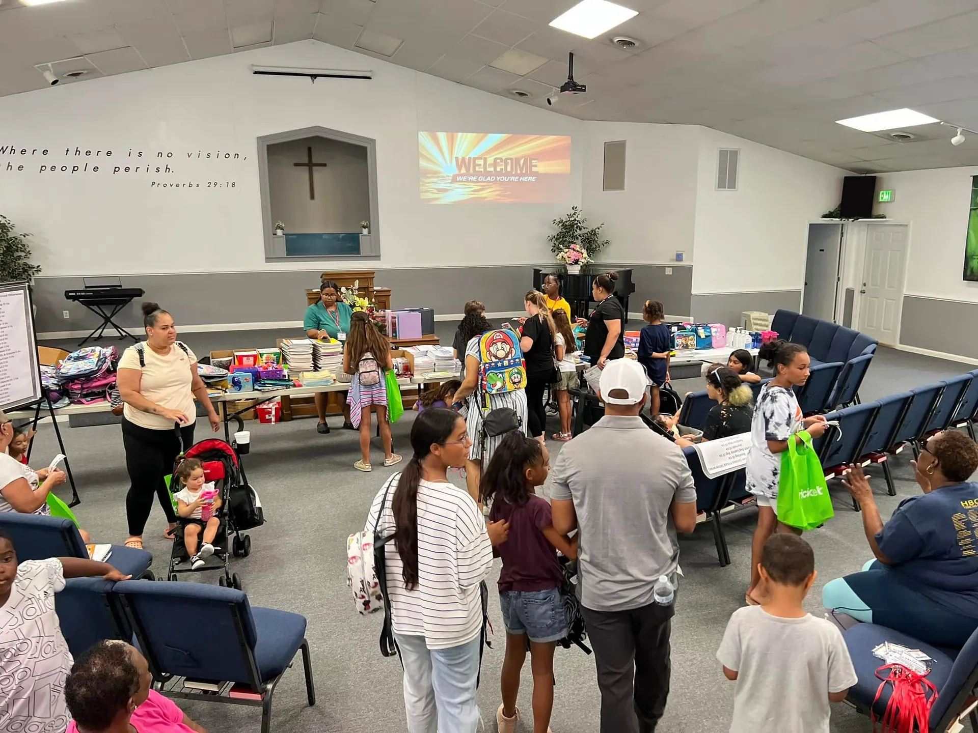 Children and families gathered together for a back-to-school celebration at New Vision Ministries